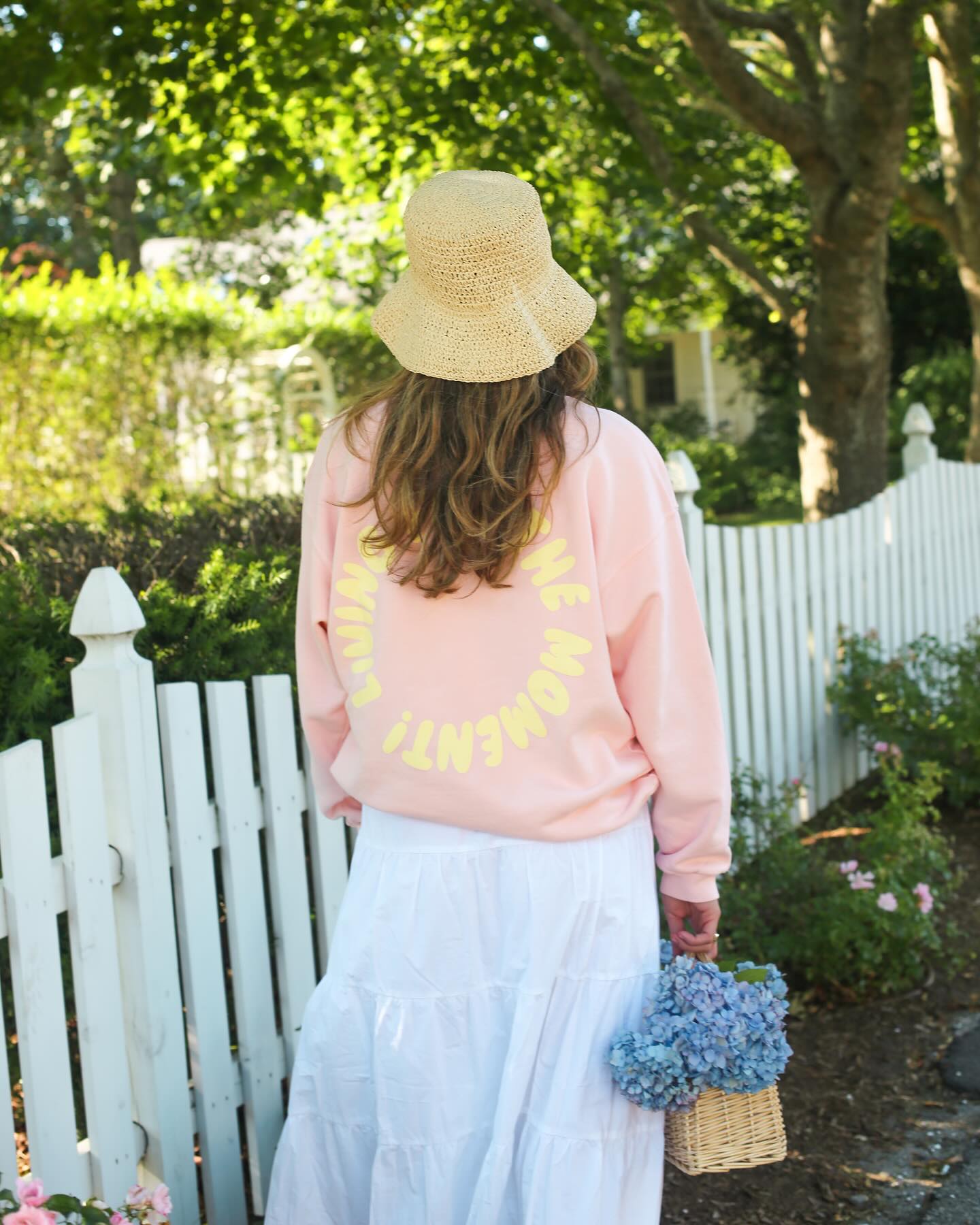 Instagram post with the caption: This summer is all about LIVING FOR THE MOMENT 🐚💛🌸💛🐚 

#upt...